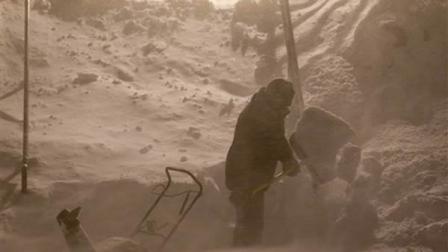 A man shovels in the early morning hours Wednesday, Feb. 2, 2011, in Milwaukee, Wis. The area is under a blizzard warning and some freeways were shut down.