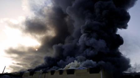 Smoke billows from warehouses during a fire in Cidade do Samba, Samba City, Rio de Janeiro, Brazil, Monday, Feb. 7, 2011. A massive fire consumed the warehouses where Rio de Janeiros samba groups store the props and costumes for Brazils largest Carnival parade. No injured were reported.