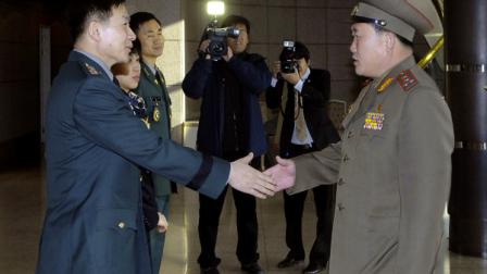 In this photo released by the Defense Ministry, North Korean Army Col. Ri Sun Gyun, right, shakes hands with South Korean counterpart Col. Moon Sang-gyun upon his arrival for their military meeting at the south side of the truce village of Panmunjom in the demilitarized zone (DMZ) that separates the two Koreas since the Korean War, north of Seoul, South Korea, Wednesday, Feb. 9, 2011. (AP Photo/Defense Ministry)