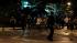 An Anti-government demonstrators run away after...