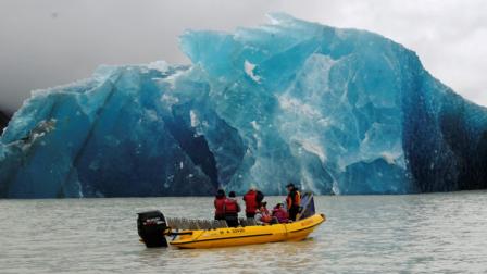 A group of people travel with Glacier Explorers to see one of the many icebergs that caved into Tasman Lake as a result of the 6.3 earthquake in Christchurch, New Zealand, Tuesday, February 22, 2011. The quake hit at the height of a busy workday, toppling tall buildings and churches, crushing buses and killing dozens of people in one of the countrys worst natural disasters.