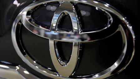 FILE - In this Jan. 26, 2011 photo, the logo of Toyota Motor Corp. shines in front of a car displayed at the Japanese automakers showroom in Tokyo. (AP Photo/Shizuo Kambayashi, file)