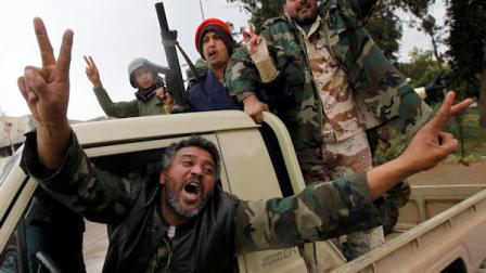 Anti-Libyan leader Moammar Gadhafi gunmen celebrate the freedom of the Libyan city of Benghazi, Libya, on Sunday Feb. 27, 2011. US President Barack Obama has called on Libyan dictator Moammar Gadhafi to leave power immediately, saying he has lost the legitimacy to rule with his violent crackdown on his own people. (AP Photo/Hussein Malla)