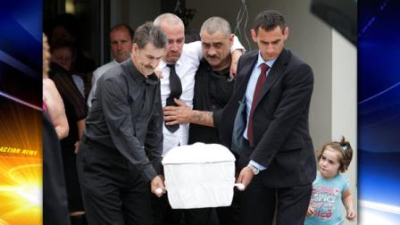 Grant Smith, 2nd left, is assisted as he walks behind the coffin of his 9-month-old son, Jayden Harris, In Christchurch, New Zealand, Wednesday, March 2, 2011. Jayden who was killed Tuesday Feb. 22, 2011 when a 6.3 magnitude earthquake hit Christchurch causing extensive damage and loss of life.