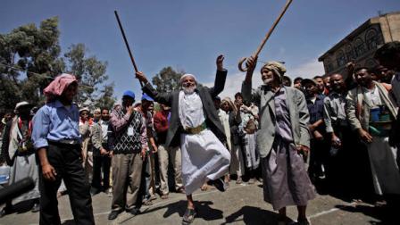 Two elderly anti-government protestors dance during a demonstration demanding the resignation of Yemeni President Ali Abdullah Saleh, in Sanaa, Yemen, Sunday, March 6, 2011. Suspected al-Qaida gunmen killed four Republican Guard soldiers on Sunday in the mountainous central province of Marib, security officials said. Also Sunday, the U.S. government, citing terrorism and civil unrest, advised Americans not to travel to Yemen and said Americans already in the impoverished Arab nation should leave. A travel warning issued by the State Department also authorized family members of U.S. Embassy staff and non-essential personnel to leave. (AP Photo/Muhammed Muheisen)