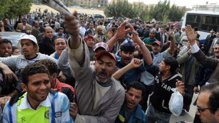 Egyptian protesters shout slogans as they gather to call for the trial of members of ousted President Hosni Mubarak in front of a court in Cairo, Egypt, Tuesday, March 8, 2011. An Egyptian court on Tuesday rejected an appeal by ousted President Hosni Mubarak and his family against a top prosecutors move to seize funds that could total in the billions of dollars. The decision clears the way for a criminal investigation and a possible trial of Egypts ousted leader.