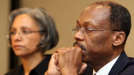 Former Haitian President Jean-Bertrand Aristide, right, looks on with his wife Mildred Aristide, left, during a press conference in Johannesburg, South Africa, Friday, Jan. 15, 2010. Exiled former Haitian President Jean-Bertrand Aristide said Friday he was ready to return to his quake-devastated country, but it was not clear when or how.