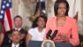 President Barack Obama looks on as First lady Michelle Obama speaks in the East Room of the White House on Tuesday, April 12, 2011, during the launch the national initiative to support and honor Americas service members and their families. Retired Gen Stanley McChrystal, the former top US general in Afghanistan who was relieved of his duty last year , has been chosen to help lead the new initiative. (AP Photo/Evan Vucci) 