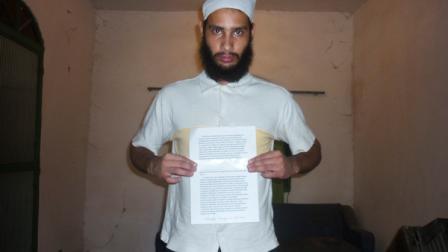 This undated photo released Friday April 15, 2011 by Rio de Janeiro states Public Safety Department (SESEG), shows Wellington Oliveira poses for the camera holding a letter he left behind that explains how he wants to be buried among other things, at an unknown location. Oliveira gunned down 10 girls and two boys aged from 12 to 15 inside the Tasso da Silveira public school, most lined up along a wall and shot in the head at point-blank range. The shooter, identified as the 23-year-old Oliveira, killed himself with one of his pistols after being confronted by police. (AP Photo/SESEG, HO)