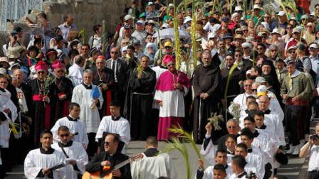 Latin Patriarch of Jerusalem Fouad Twal, center, is seen as he participates in the traditional Palm Sunday procession on the Mount of Olives, in Jerusalem, Sunday, April 17, 2011. Palm Sunday commemorates Jesus Christs triumphant entry into Jerusalem, and is the start of the Christian Holy Week. (AP Photo/Tara Todras-Whitehill)