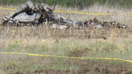 Wreckage from a small plane crash that killed all four passengers aboard lies in a corn field, Friday, April 22, 2011, northeast of Topeka, Kan. (AP Photo/John Hanna)
