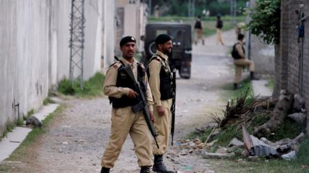Pakistani army troops guard the perimeter of the walled compound of a house where al-Qaida leader Osama bin Laden was caught and killed in Abbottabad, Pakistan, on Thursday, May 5, 2011. The residents of Abbottabad, Pakistan, seem to be confused and suspicious about the killing of Osama bin Laden by a U.S. military force, which took place in their midst before dawn on Monday. (AP Photo/Anjum Naveed)
