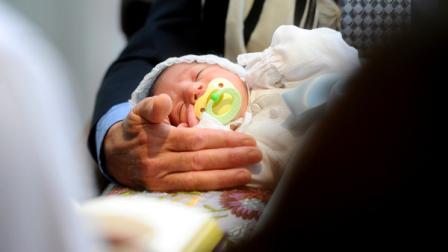 In this Sunday, May 15, 2011 photo, Benjamin Abecassis closes his eyes during his Bris, a Jewish circumcision ceremony in San Francisco. San Francisco voters in November will be asked to weigh in on what was until now a private family matter: male circumcision. City elections officials confirmed Wednesday, May 18, 2011 that an initiative that would ban the circumcision of males younger than 18 in San Francisco has received enough signatures to appear on the ballot. The practice would become a misdemeanor. (AP Photo/Noah Berger)
