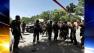 Afghan National Army soldiers arrive at the Kabuls main military hospital in Kabul, Afghanistan, Saturday, May 21, 2011. The Afghan Defense Ministry says a suicide bomber blew himself up inside a tent filled with medical students eating lunch at a military hospital in Kabul Saturday, killing at least six people and wounding 23.(AP Photo/Mustafa Quraishi)  