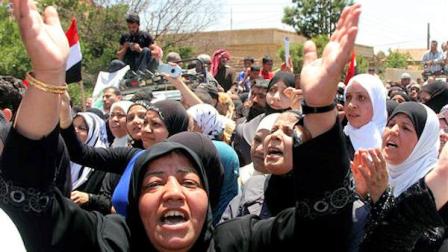 Palestinian women react during the funeral procession of the Palestinian protesters who killed when Israeli soldiers opened fire on Sunday at protesters who tried to burst across Syrias frontier with the Israeli-controlled Golan Heights, at Khan al-Shih Palestinian refugee camp, some 25 kilometers far from Damascus, Syria, on Monday June 6, 2011.