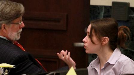 Casey Anthony, right, talks with her attorney Cheney Mason during a break in her murder trial at the Orange County Courthouse, Monday, June 6, 2011, in Orlando, Fla.