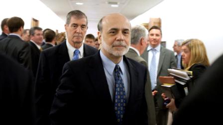 Federal Reserve Chairman Ben Bernanke leaves a Senate Banking Committee hearing on the status the Dodd-Frank implementation, Thursday, May 11, 2011, on Capitol Hill in Washington.