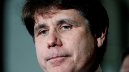 Former Illinois Gov. Rod Blagojevich pauses as he talks with reporters at the Federal Court building after the judge handed the case to the jury in his corruption trial Thursday, June 9, 2011 in Chicago. (AP Photo/Charles Rex Arbogast)