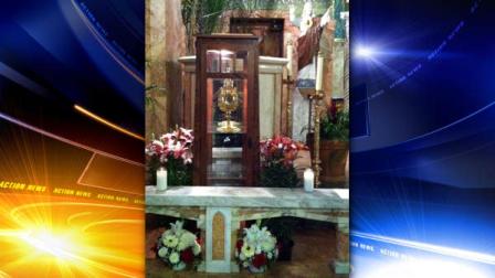 This undated photo provided by Father Brian Doran of the St. Anthony Catholic Church in Long Beach, Calif. via the Long Beach Police Department shows a 780-year-old religious relic of St. Anthony, the patron saint of lost causes and missing objects, center in cabinet, that was stolen from the church on Monday, June 13, 2011.