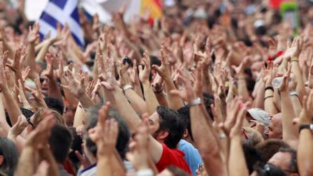 Protesters gesture outside of the Greek Parliament in central Athens, prior to a rally against plans for new austerity measures, on Wednesday, June 15, 2011. A 24-hour strike by Greeces largest labor unions is set to cripple public services Wednesday, as the Socialist government begins a legislative battle to push through last-ditch cost cutting reforms that will exceed its own term in office. Demonstrators had camped outside parliament since May 25, 2011.