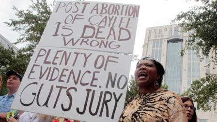 Flora Reece protests outside the Orange County Courthouse in Orlando, Fla., Thursday, July 7, 2011. Casey Anthony, who was acquitted of killing her daughter, Caylee Anthony, faces sentencing for lesser charges.