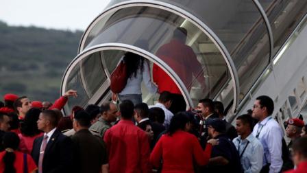 Venezuelas President Hugo Chavez and his daughter Rosa Virginia walk up the stairs to a plane as they depart for Cuba from Simon Bolivar international airport in Maiquetia on the outskirts of Caracas, Venezuela, Saturday July 16, 2011. Chavez left home Saturday for Cuba to begin chemotherapy, vowing to win his fight against cancer and calling for his political allies to stay united in his absence. Earlier in the day, Chavez announced he was delegating some of his duties to his vice president and finance minister as he prepared to fly to Cuba. (AP Photo/Ariana Cubillos)