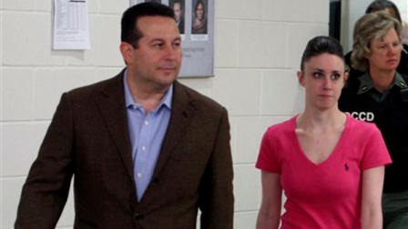 Casey Anthony, front right, walks out of the Orange County Jail with her attorney Jose Baez, left, during her release in Orlando, Fla., early Sunday, July 17, 2011. Anthony was acquitted last week of murder in the death of her daughter, Caylee.