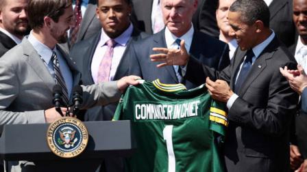 President Barack Obama is presented a Green Bay Packers football jersey by quarterback Aaron Rodgers, left, during a ceremony honoring the Super Bowl XLV Champion Green Bay Packers, Friday, Aug. 12, 2011, on the South Lawn of the White House in Washington. General Manager Ted Thompson is at center. (AP Photo/Pablo Martinez Monsivais)