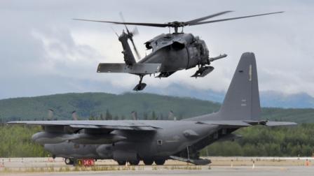 An Alaska Air National Guard HH-60G Pave Hawk helicopter lands to transfer plane crash victims to a waiting HC-130 at the McGrath airport on Sunday afternoon, Aug. 14, 2011. Authorities say two people have died in a plane crash in the Alaska wilderness, and four others on board the small aircraft survived. (AP Photo/The Anchorage Daily News, Courtesy Bill Minnix) THE MAT-SU VALLEY FRONTIERSMAN OUT