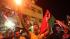 People celebrate the recent news of uprising in...