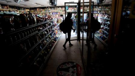 Deborah Springs shops in a convenience store for food items after a power outage Thursday, Sept. 8, 2011, in San Diego. A power outage is affecting millions of people across southern California, Arizona and Mexico. San Diego Gas and Electric Co. Darcel Hulce said that crews Thursday believe the outage was caused by a system breakdown and assured people it was not the result of a terror attack. (AP Photo/Gregory Bull)