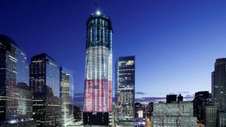 One World Trade Center overlooks the ground zero memorial site, Saturday, Sept. 10, 2011, in New York. Ceremonies will be held at the site Sunday for the 10th anniversary of the September 11 attacks. (AP Photo/Mark Lennihan)