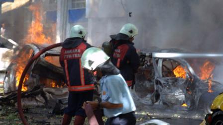 Firefighters are seen working at the site of a suspected car bomb explosion in a busy street in the Turkish capital Ankara, Turkey, Tuesday, Sept. 20, 2011. A car bomb went off near a high school in the Turkish capital on Tuesday, igniting other vehicles and killing three people in a nearby building, authorities said. The blast also wounded 15 people.