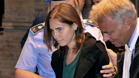 Amanda Knox, accompanied by her lawyer Carlo Dalla Vedova, arrives for an appeal hearing at the Perugia court, central Italy, Monday, Oct. 3, 2011. A tearful Amanda Knox has told an appeals court in Italy that accusations that she killed her British roommate are unfair and groundless. Knox fought back tears as she addressed the court Monday, minutes before the jury went into deliberations to decide whether to uphold her murder conviction. A verdict is expected later in the day.