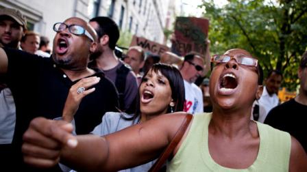 Protestors affiliated with the Occupy Wall Street protests chant outside 834 Fifth Avenue, where Rupert Murdoch lives, in New York, on Tuesday, Oct. 11, 2011. The crowd marched through out the Upper East Side neighborhood, protesting outside the homes of various millionaires and bank owners.