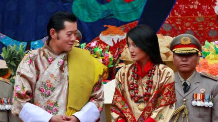 King Jigme Khesar Namgyal Wangchuck, center left and Queen Jetsun Pema look at each other as they stand during Buddhist blessings prior to their marriage ceremony at the Punakha Dzong, in Punakha, Bhutan, Thursday, Oct. 13, 2011. The 31 year-old reformist monarch of the small Himalayan Kingdom wed his commoner bride in a series of ceremonies at the monastic fortress Thursday.