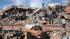 People try to save people trapped under debris...