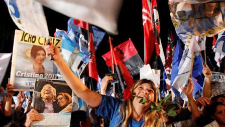 Supporters of Argentinas President Cristina Fernandez celebrate her re-election after general elections in Buenos Aires, Argentina, Sunday Oct. 23, 2011. Fernandez has been re-elected by a landslide. Exit polls say Fernandez has gotten 54 percent to 55 percent of the votes cast in Sundays election, the widest victory margin for any Argentine president since democracy was restored in the country three decades ago. (AP Photo/Eduardo Di Baia)