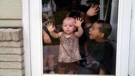 This photo provided Oct. 4, 2011, by the Kansas City, Missouri Police Department, shows Lisa Irwin, center. The parents of the 10-month-old Kansas City girl who disappeared from her bed days ago have been cooperative and arent considered suspects, police said, as federal agents searched the familys home with dogs. Lisa was last seen around 10:30 p.m. Monday when her mother put her to bed.