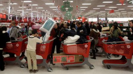 Customers wait in line at a Target store in Colma, Calif., Friday, Nov. 26, 2010.