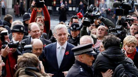 The founder of WikiLeaks Julian Assange, center, arrives for his extradition hearing at the High Court in London, Wednesday, Nov. 2, 2011. Assange is returning to court to learn if he will be sent to Sweden to answer sex crime allegations. The 40-year-old was awaiting a judgment scheduled to be delivered Wednesday on his appeal against extradition. Swedish authorities want to question Assange over the alleged rape of one woman and the molestation of another in Stockholm last year. Assange denies wrongdoing, and insists the case is politically motivated.