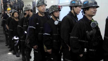 In this photo released by Chinas Xinhua news agency, rescuers queue up to carry out rescue missions after a rock burst occurred in a coal mine in central Chinas Henan Province, Friday, Nov. 4, 2011. The state news agency says a sudden ejection of rock has killed four miners and trapped 57 others underground. (AP Photo/Xinhua, Zhu Xiang) NO SALES