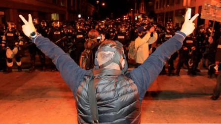 Add to Current Lightbox
An Occupy protester shows peace signs to Oakland Police officers in Oakland, Calif., Thursday, Nov. 3, 2011.