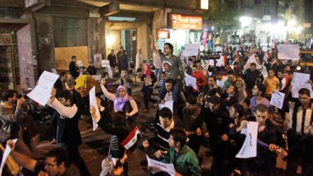 In this Nov. 26, 2010, file photo, activists shout anti-government slogans as they march through the low-income neighborhood of Imbaba, in Cairo, Egypt. Egyptian activists organized several small Day of Anger rallies across the country to protest police violence during the parliamentary election campaign, with the rallies organized via Facebook and tweets. The team from the CIAs Open Source Center, housed in a unassuming brick building in a Virginia industrial park, pores daily over tweets, Facebook, newspapers, TV news channels, local radio stations, Internet chat rooms _ anything overseas that anyone can access, and contribute to, openly. The center saw the uprising in Egypt coming said the centers director, Doug Naquin. The center already had predicted that social media in places like Egypt could be a game-changer and a threat to the regime, he said in a recent interview with The Associated Press.