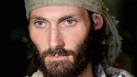 Matthew VanDyke, who spent months in Libyan prisons before joining rebel forces who opposed dictator Moammar Gadhafi, speaks with reporters after his flight arrived at Baltimore-Washington International Airport in Linthicum, Md., Saturday, Nov. 5, 2011.