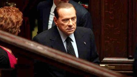 Italian Premier Silvio Berlusconi arrives at the Lower Chamber in Rome, Saturday, Nov. 12, 2011. Premier Silvio Berlusconi is expected to resign Saturday after the Parliaments lower chamber passed a panel of austerity reforms, ending a 17-year political era and setting in motion a transition aimed at bringing Italy back from the brink of economic crisis. (AP Photo/Pier Paolo Cito)