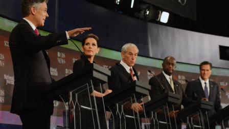 Republican presidential candidates from left, Jon Huntsman, speaks as Michele Bachmann, Ron Paul, Herman Cain, and Mitt Romney, listen during the CBS News/National Journal foreign policy debate at the Benjamin Johnson Arena, Saturday, Nov. 12, 2011 in Spartanburg, S.C. (AP Photo/Richard Shiro)