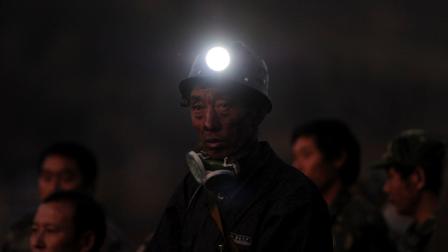 In this Thursday, Nov. 10, 2011 photo, a miner stands waiting for rescue news at the Sizhuang Coal Mine after a gas leak in Shizong county of Qujing city, in southwest Chinas Yunnan province. Hundreds of rescuers took turns descending into an illegally operated coal mine Thursday to search for 23 Chinese miners trapped by a gas leak that killed 20 others, in the countrys second deadly mining accident in less than a week. (AP Photo) CHINA OUT