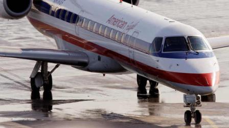 In this Jan. 20, 2011, file photo, an American Eagle jet taxis at Bostons Logan International Airport. The Transportation Department announced Monday, Nov. 14, that they are fining the regional affiliate of American Airlines $900,000 for keeping passengers cooped up on planes for over three hours in Chicago at OHare International Airport earlier this year.