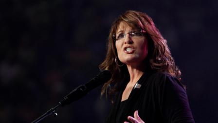 Former Alaska governor and vice presidential candidate, Sarah Palin, gestures during a speech at the Extraordinary Women Conference at Liberty University in Lynchburg, Va., Saturday, Oct. 8, 2011. (AP Photo/Steve Helber)